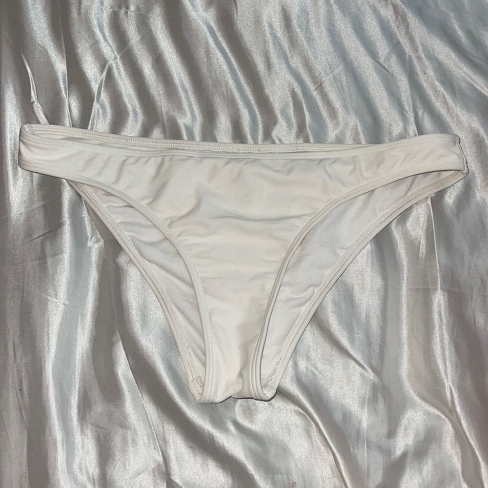 White bikini bottoms never worn. Mostly full coverage a little cheeky